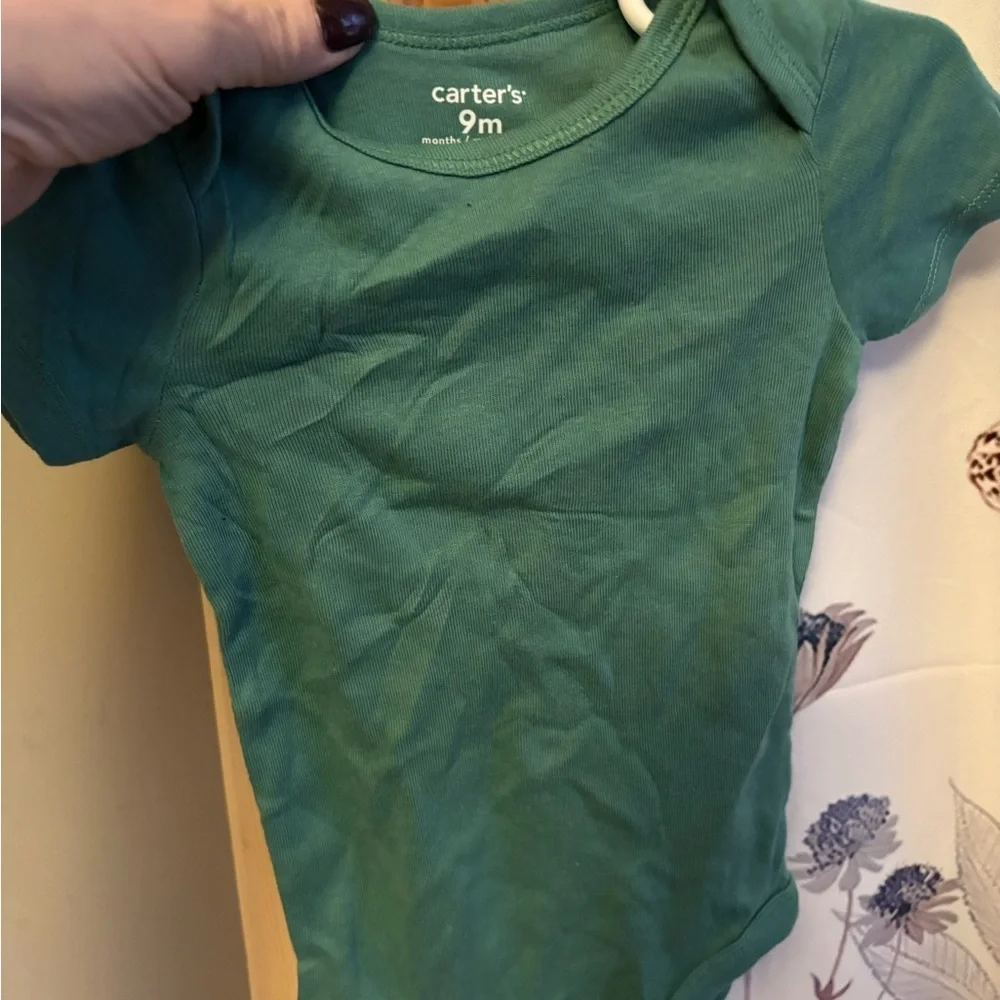 Carter's Cream Bodysuit with Animal Design.  5 size 9 months onesies for $15